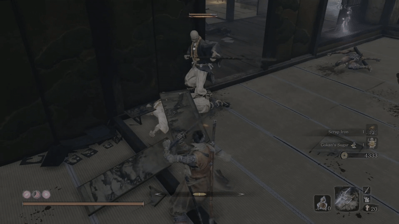 A ninja in a red coat and scarf attacks a spearman in an old-japanese-style interior. The ninja is stabbed, but blocks the followup attack, breaking his opponent's guard before stabbing him through.